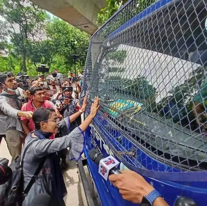 Police was arresting peaceful student protestors. This girl stood in front of police van so that they can not take students away. Police are crossing limits in Bangladesh. They are violating international law.