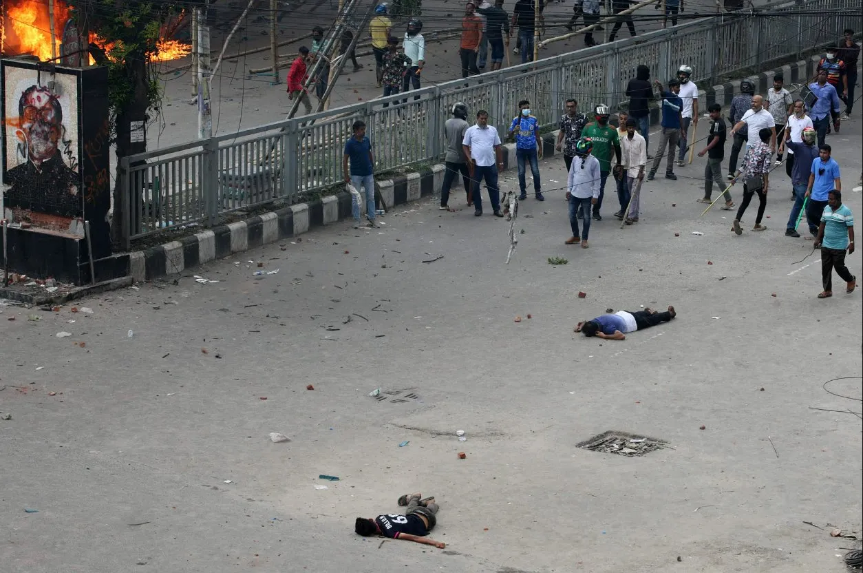 Two bodies seen lying on the street in Uttara area in Dhaka after ruling party men and police attack students and they clashed with the former. Prothom Alo reports at least 56 bullet-wounded admission in Dhaka Medical College.